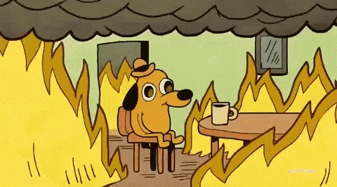Cachorro sentado numa sala em chamas dizendo que está tudo bem